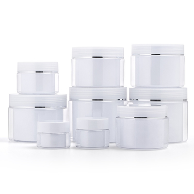I barattoli della parete affrontano il cosmetico del barattolo della crema della plastica di trucco delle lozioni di cura di pelle dei capelli della mano
